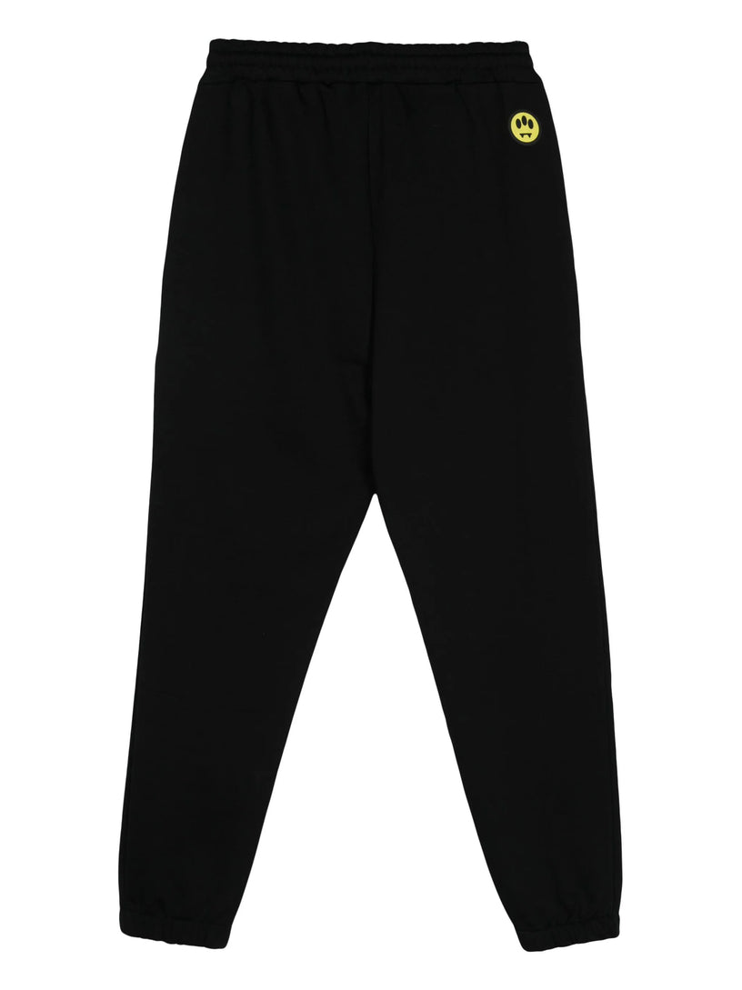 Sports trousers with rubberized logo