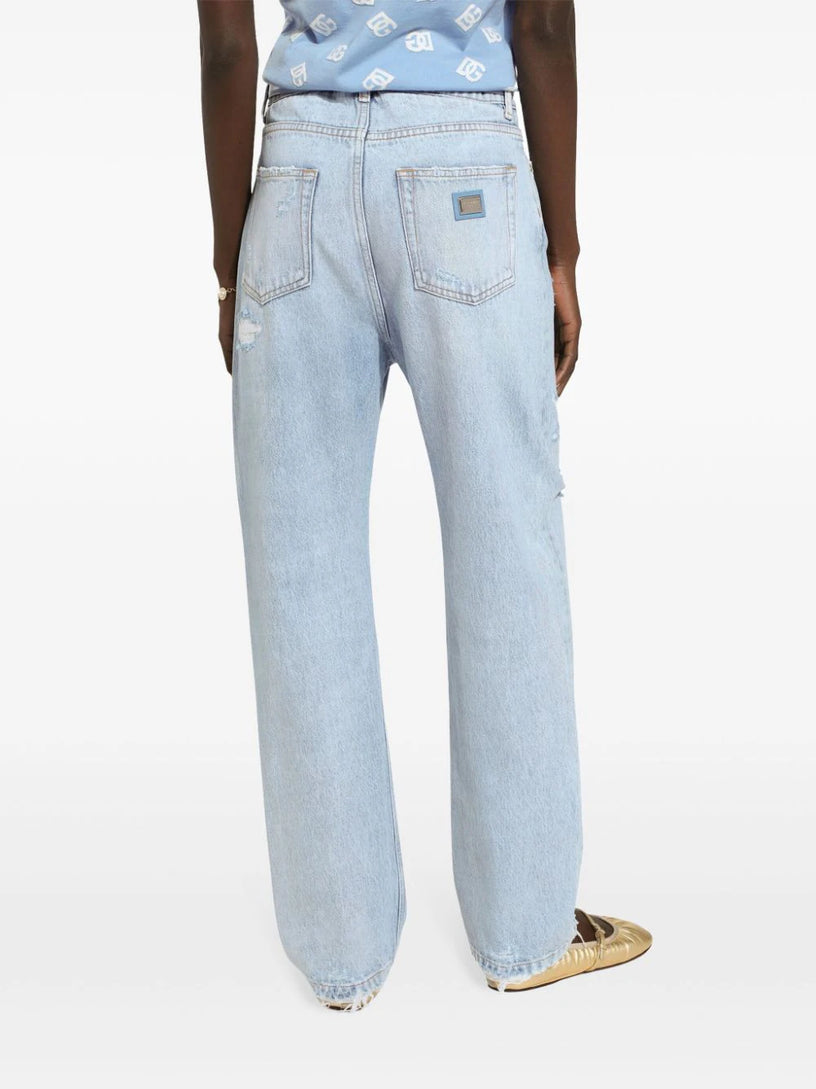 Distressed finish straight-legged jeans