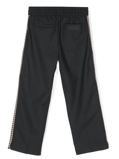 Trousers with braid