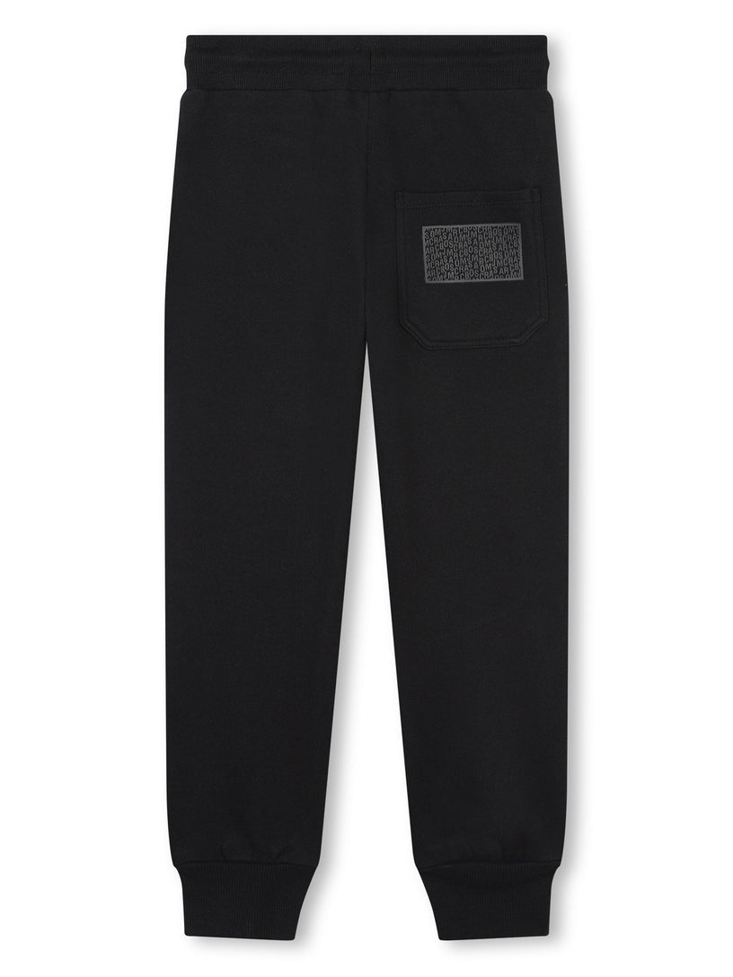 Sports trousers with rubberized logo