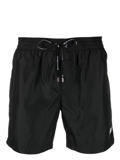 Swim trunks with logo tag